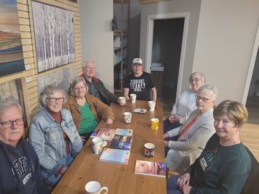 8 retired teachers sharing coffee